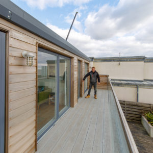 Ian is showing where the previous dormer window and balcony stopped before